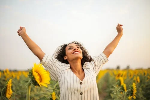 happy woman with sunflowers