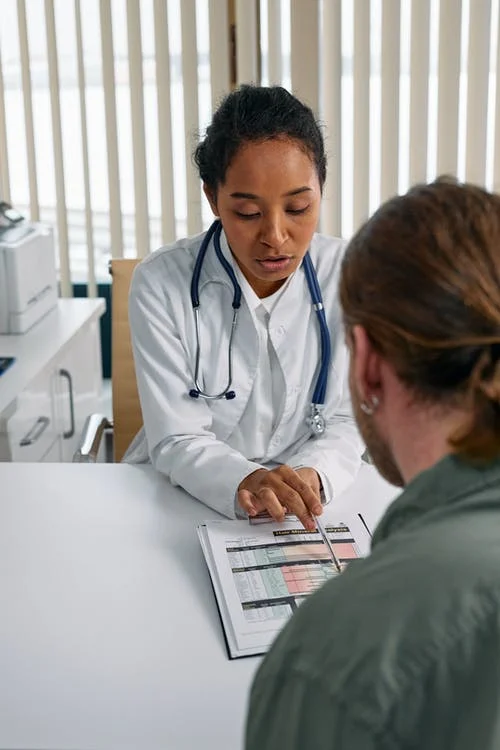 female doctor advising male patient