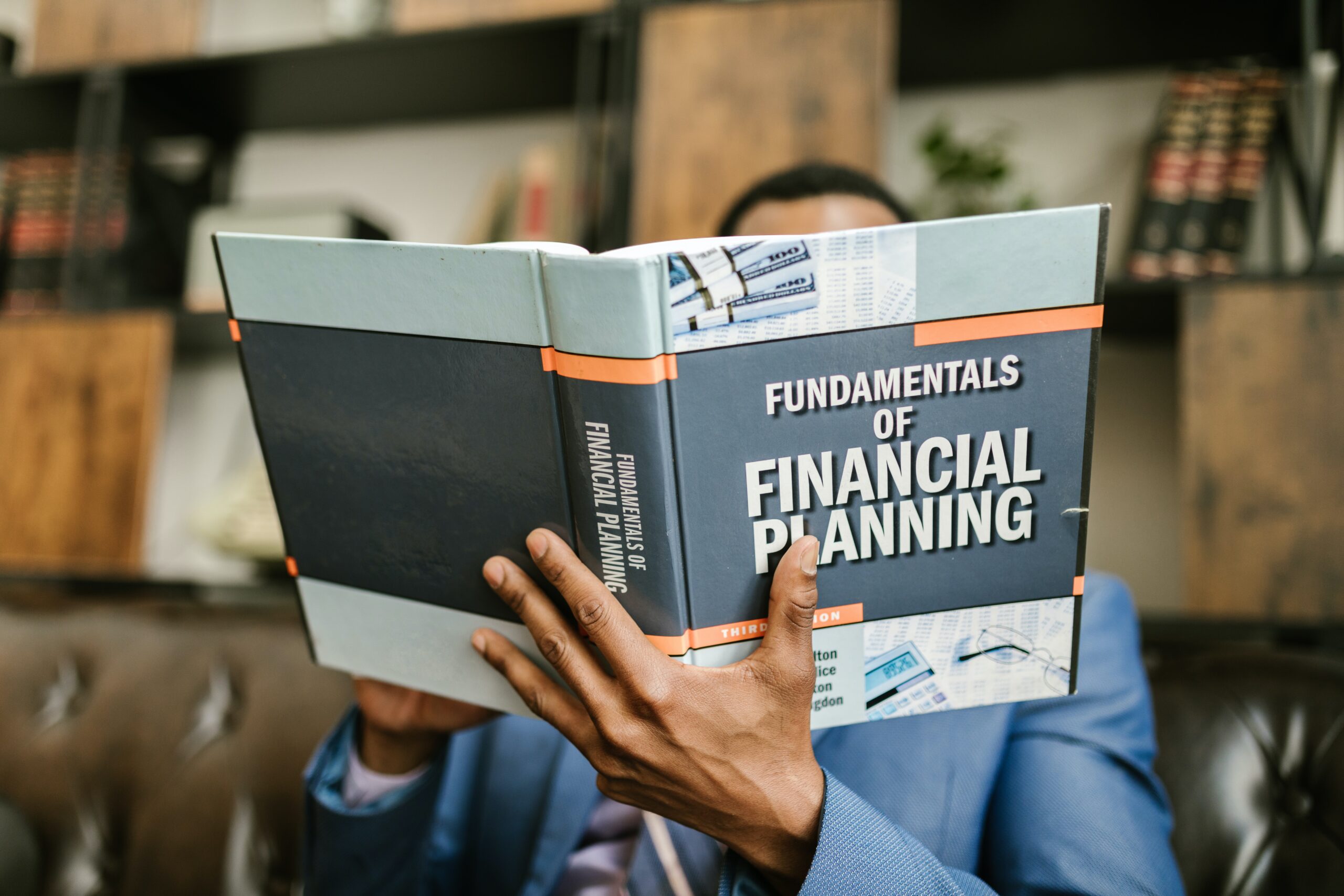 hand with financial planning book