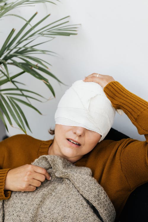 woman with head bandage