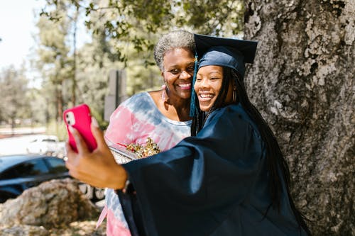 proud graduate with parent