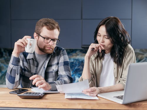 Man and woman discussing finances